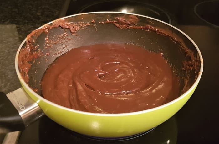 5) After 10 minutes, the mixture should have a much thicker consistency and be darker in colour. The cooking is complete when the mixture easily comes away from the surface of the pan and you can make a trench through the mixture which holds.
