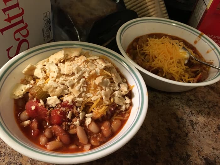 I like my chili with sour cream, cheddar cheese, and crackers. But you can top it with anything you like.