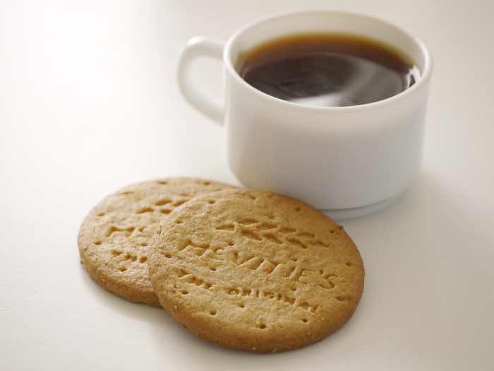 Some people like to drink coffee with their biscuits.