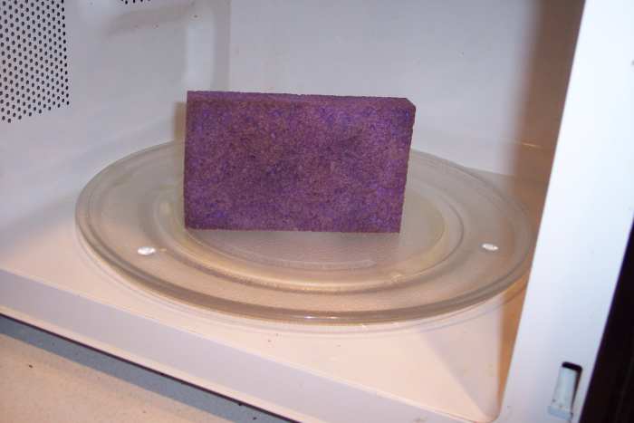 With their many surfaces, sponges are especially susceptible to microbes. Don't bother soaking them. After rinsing them off, either put them in the microwave, on high, for a minute or run them through a cycle in the dishwasher. Replace them regularly