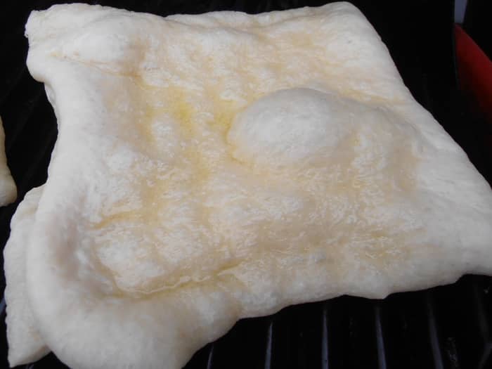 Don't forget to brush on some olive oil so your dough doesn't stick to your grill. This would be a real rookie mistake, yes I have done it myself! It's not pretty!