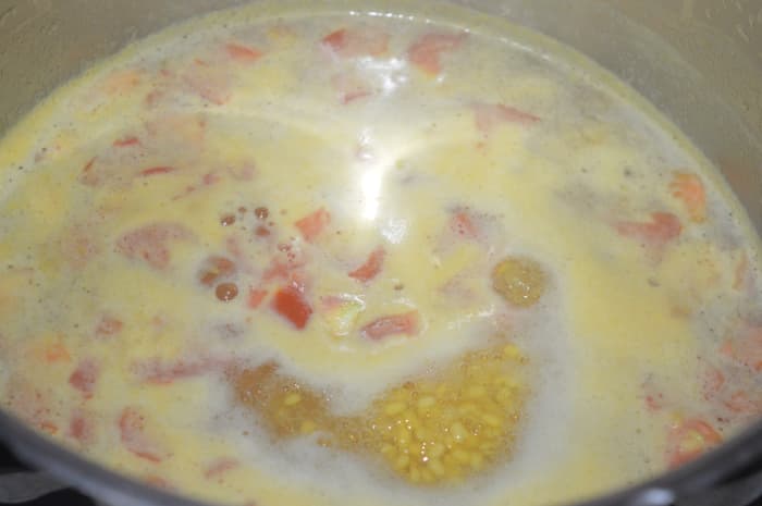 Step six: Boil the mix for 2 minutes. Cover the cooker lid. Cook up to 2 whistles and simmer for 3 minutes. Turn off the fire.