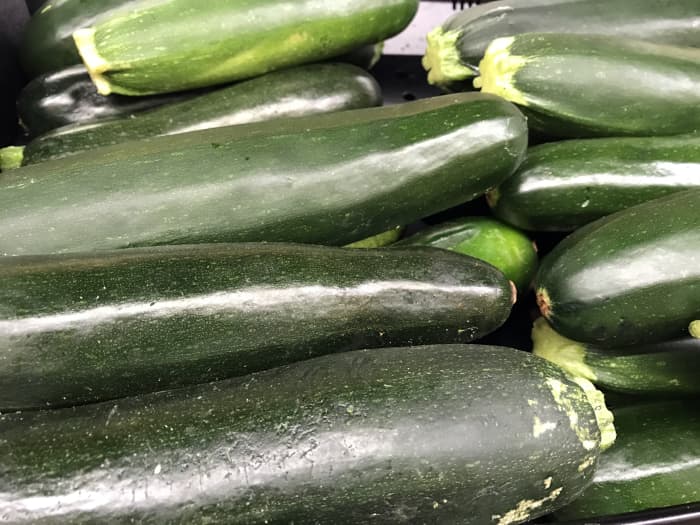 Zucchinis vary in quality, so pick yours carefully. It can impact the taste of your recipe. There is no need to peel the skin off zucchinis. However, remove the ends and wash the outside well.
