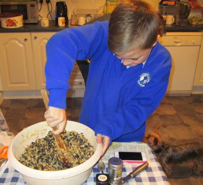 Stirring the Christmas plum pudding and making a wish: an Irish holiday tradition.