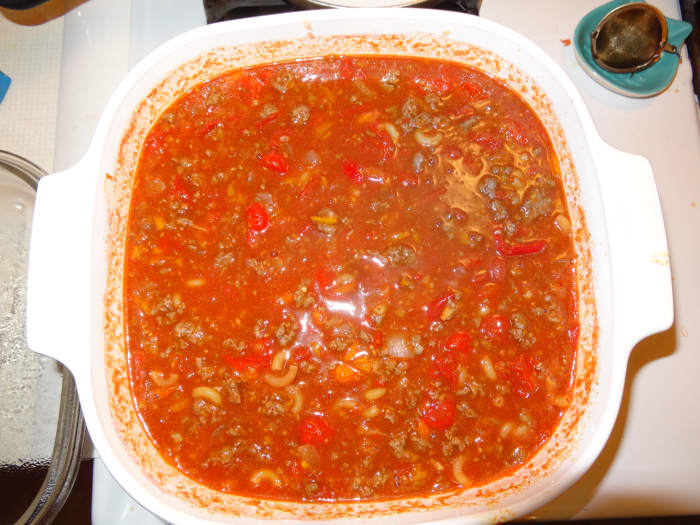 Add the meat, roasted tomatoes and peppers, bell pepper, and tomato juice to a large stock pot. Bring to a boil then add macaroni and chili beans, cook 7–10 minutes, stirring frequently. Remove from heat and stir in lime juice.