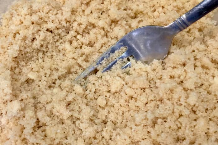 The crumb topping should resemble bread crumbs after "cutting in" the vegan buttery spread or coconut oil.