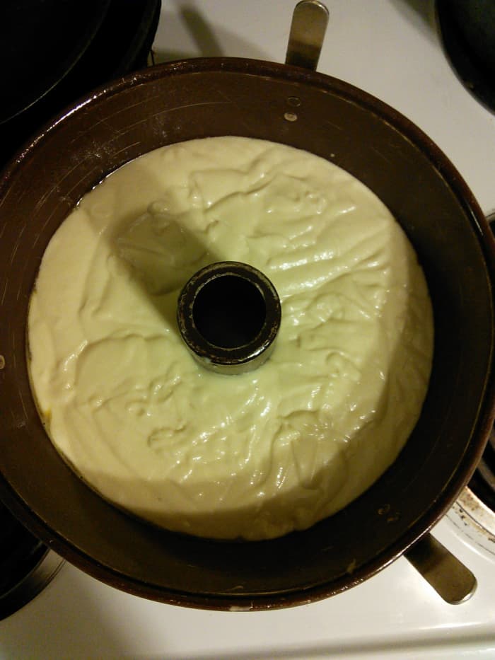 Pour your batter evenly into your bundt pan. Shake it gently to level it out if need be. Bake it at 350°F for 1 1/2 hours. Do not peek at it until the timer says 30 minutes. Be very quiet about it.