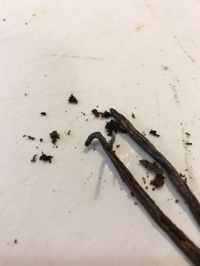 The rich, dark color of good vanilla bean is striking against the pure white of the beaten egg whites. Use a sharp knife to scrape the seeds away from the pod. Every last one brings flavor!