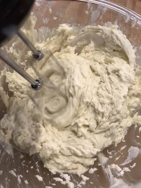 Keep working in the milk/flour mixture until it's all incorporated, and the frosting has a smooth, creamy consistency.