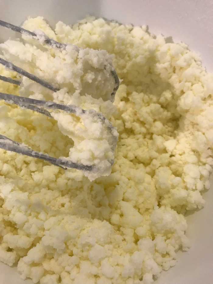 Adding the cream a little at at time allows you to control the consistency of the finished frosting. I've found 4 tablespoons is almost always perfect, but if you want a stiffer frosting, use less. If your frosting is too stiff, add just a touch more