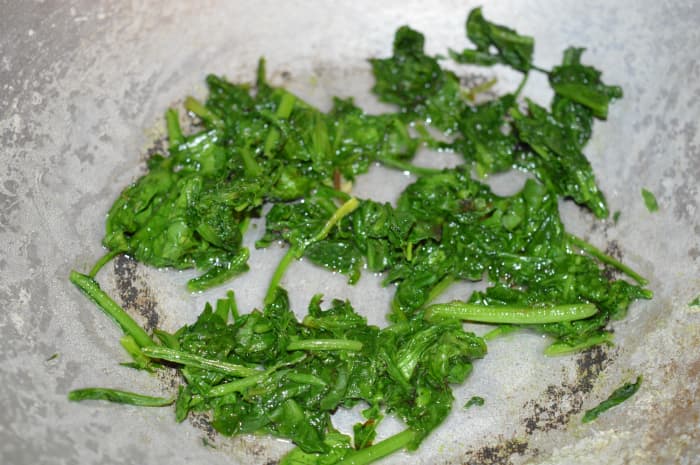 Step 1: Wash spinach and roughly chop your spinach, then sauté for two minutes, adding some salt. Transfer it to a mixing bowl.
