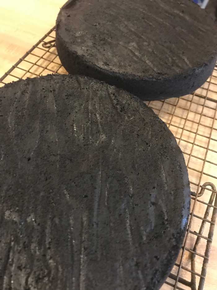 Allow the cakes to cool in their pans for ten minutes before inverting them onto wire racks and removing the parchment papers to cool completely before frosting.