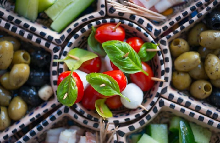 Unfortunately, not everyone can enjoy delights like fresh tomatoes, briny olives, and creamy mozzarella.