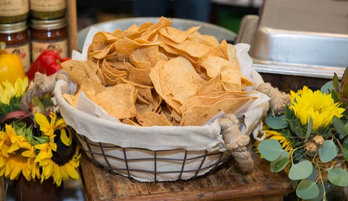 Baked, multi-grain tortilla chips or veggie chips in moderation can satisfy your mouth's yearning for extra crunch and texture.