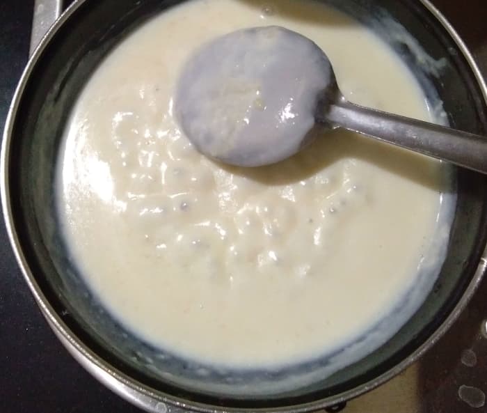 Step six: Add milk. Combine the flour and milk by stirring continuously. Bring it to a boil. Simmer for a minute.