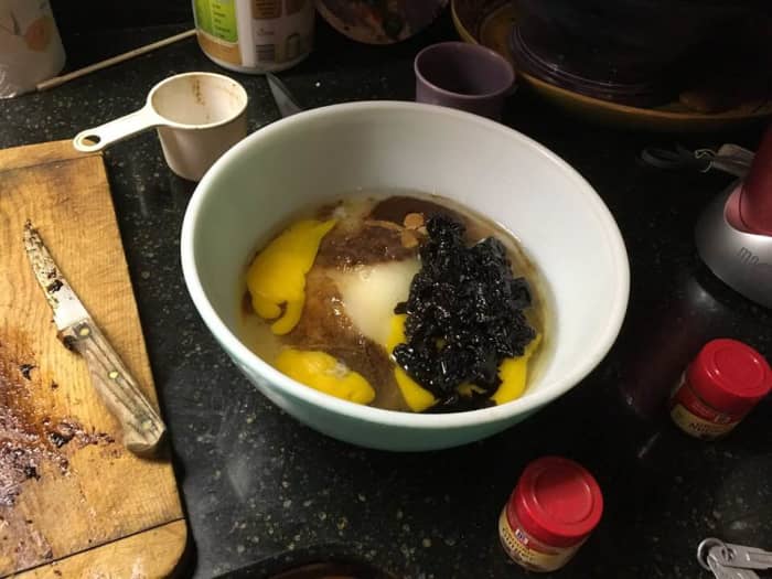 Combine the roughly chopped prunes, 1 cup water, 2 cups flour, 2 cups sugar, 2 teaspoons ground ginger, 4 eggs, 1 teaspoon ground cinnamon, 2 teaspoons baking soda, 1 teaspoon ground nutmeg, 1/2 teaspoon salt, and 1 1/2 cups vegetable oil together.