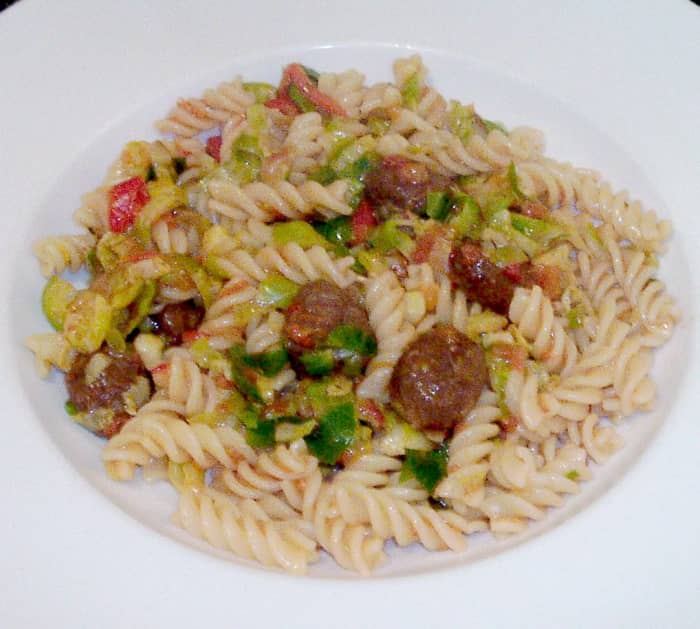 Shredded Brussels sprouts and fusilli pasta are infused with wagyu beef meatballs in tomato salsa sauce