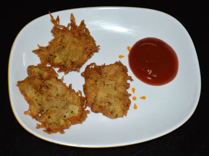 Now, your favorite hash browns are ready to munch! Serve a few of them hot in a plate with tomato ketchup on the side. Enjoy eating this awesome snack.