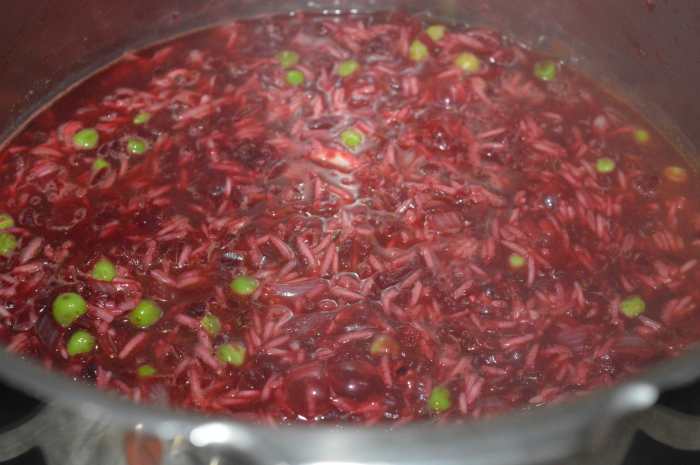 Step eight: Increase the heat. Add about 3 1/2 cups of water. Mix well. Let the mix come to a gentle boil. Simmer for 2 to 3 minutes. Now, close the cooker lid.