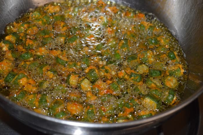 Step 5: Reduce the heat once okra shrinks in size and the sizzling sound lessens. Fry until they become crispy and golden brown.