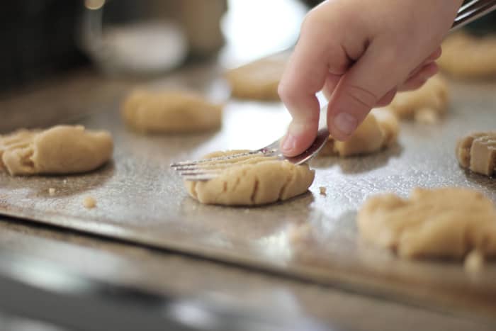 When I was a child, my favorite part of making PB cookies was squishing the dough balls with a fork.