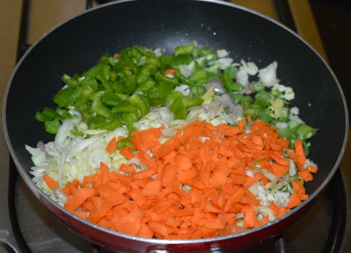Step three: Add all the veggies and a bit of salt. Saute over high heat until veggies become soft yet retain crunchiness.