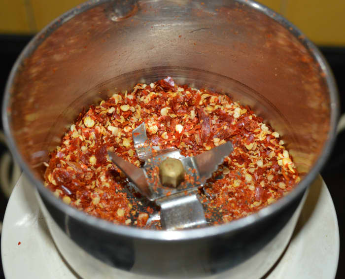 Step two: Pulse the mixer 2-3 times for very short period. Otherwise, if you run it for a longer time, you may get chili powder instead of chili flakes. You should be careful in this step. Pulse until you get the needed consistency.