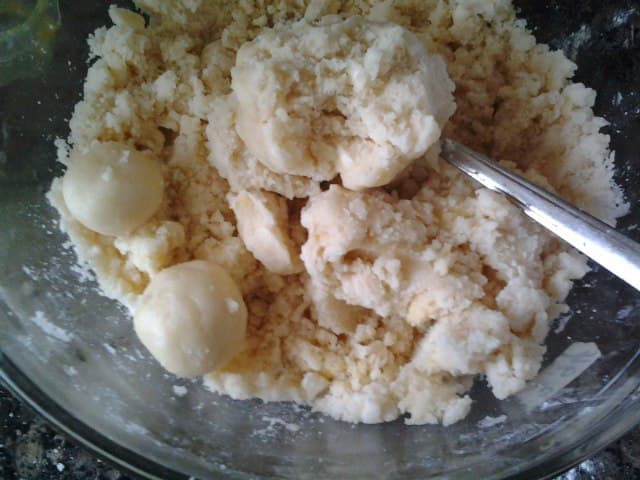 Test to see if the dough is of the required consistency by rolling some balls. If they dont crumble and fall apart, you are ready to continue on to the next steps.