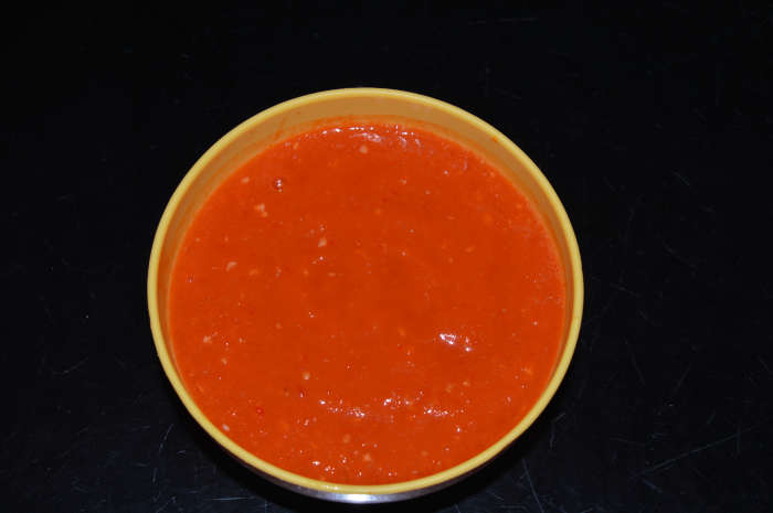 Step two: Grind ingredients together, adding water little by little to get a smooth and semi-solid sauce. Pair this yummy dip with hot momos. Enjoy eating the combo!