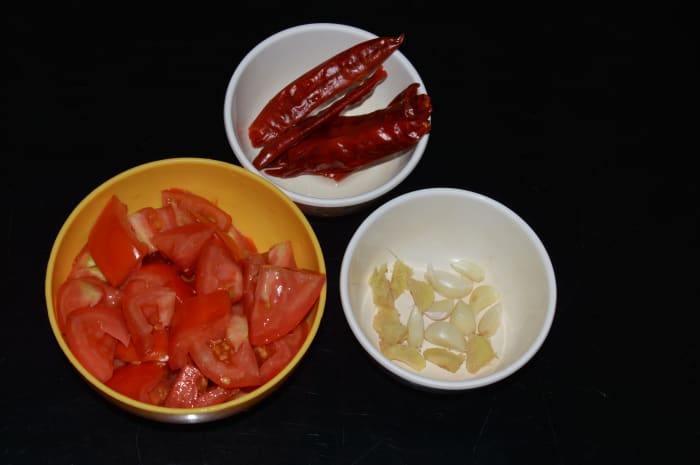 Step one: Soak hot red chilies in water for 8 hours. Next, discard the water. Gather all other ingredients as per the list.