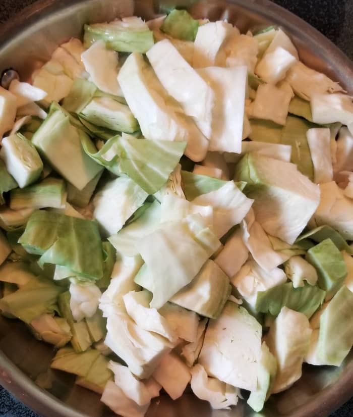 Chop cabbage into rough squares. Place in a skillet with a little oil to coat the bottom of the pan. Fry over medium heat, stirring occasionally.