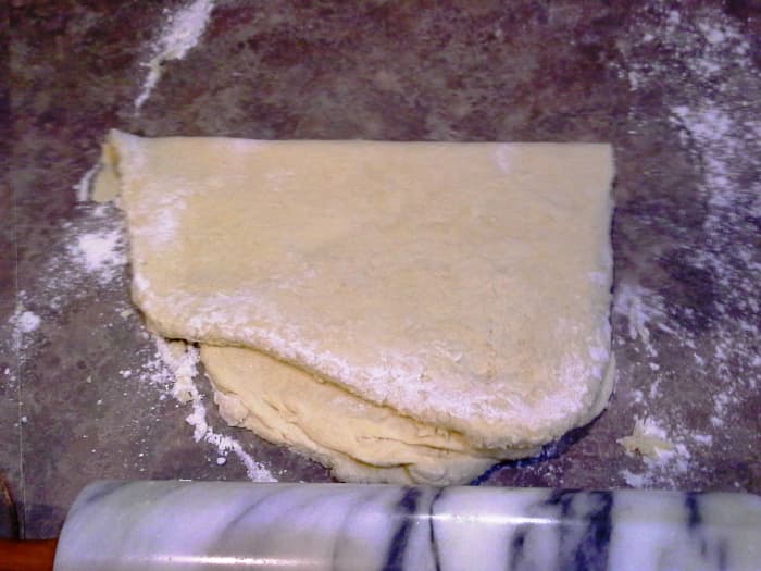 Fold over and roll out again lightly; Repeating this process several times will give you the layers you are looking for.
