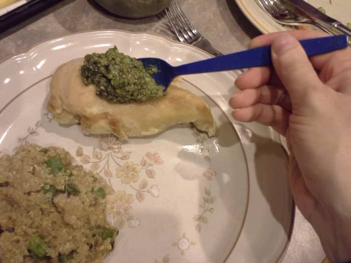 Step Thirteen: Plate your chicken and spread your pesto sauce over the top of each breast