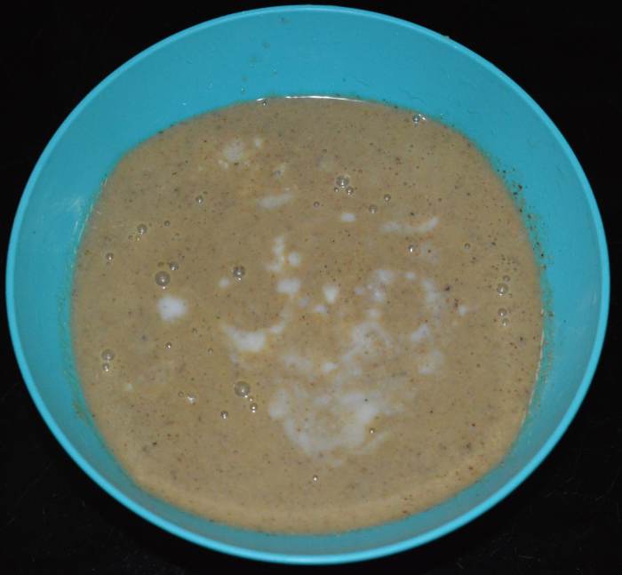 Step three: Grind, adding curd or water, to get a smooth paste. Add remaining curds. Add more water to adjust the consistency. Throw in some salt. Be careful while adding salt because the pickled mangoes are already salty.