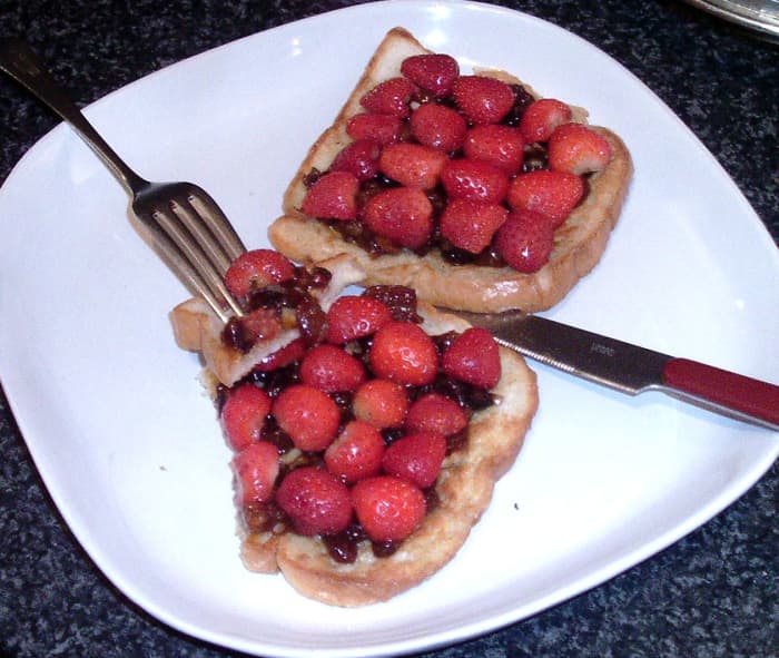 Mincemeat Spread on Cinnamon- and Cumin-Spiced French Toast With Halved Fresh Strawberries Arranged on Top