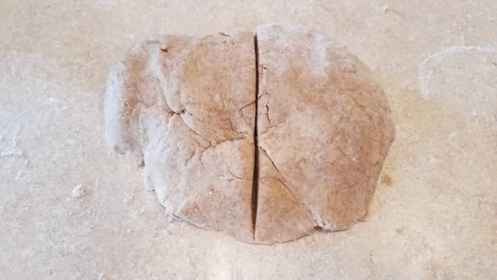 Knead it together with your hands to combine all ingredients. You want a nice soft dough. Cut it into two pieces for your two pie crusts.