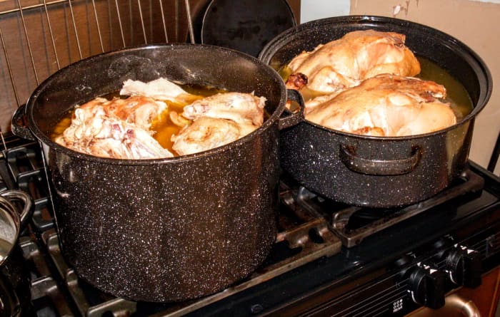 We filled each vessel about halfway with good water, to make a deeply colored broth. Of course, the quality of your chickens and how long you cook them will determine the color and richness of the broth.