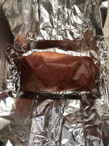 The pork shoulder is done at the perfect temperature of 203 degrees and it's ready for a little nap in it's aluminum security blanket for at least ten minutes.