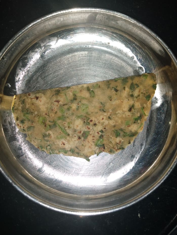 Heat tawa and place the tepla on it. Cook on medium to high flame, flipping and cooking on both sides while applying ghee or oil. Serve hot.