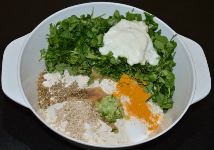 Step one: As per instructions, add all of the ingredients to a large mixing bowl. Knead, adding just enough water to make a firm and pliable dough.