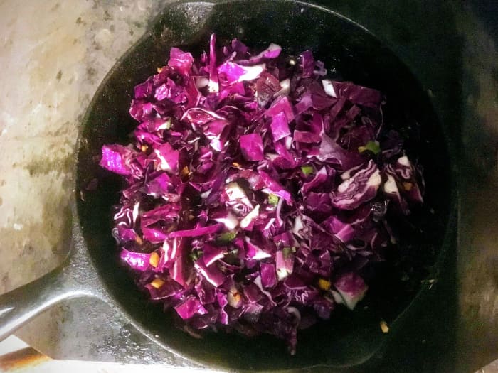 You may shred or chop the cabbage, as you wish. Chopping is faster, and offers more "bite," but shredding picks up more flavor and cooks quickly.