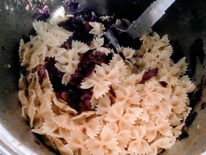Stir the nearly done pasta into the cabbage, and let it finish cooking. Stir to coat with butter and spices.