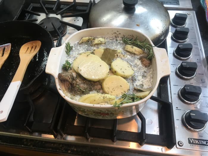 Pour the milk over it, so that it is almost covered. Place it into a preheated oven at 350°F for 70 minutes, leaving the top open.