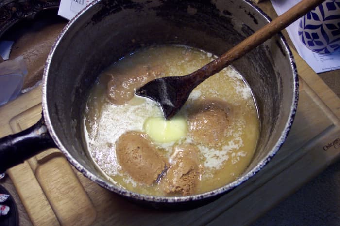 After dropping in the butter and peanut butter, briefly allow them to melt a little. But don't expect them to dissolve completely before starting to beat. Don't wait much longer than two to four minutes.