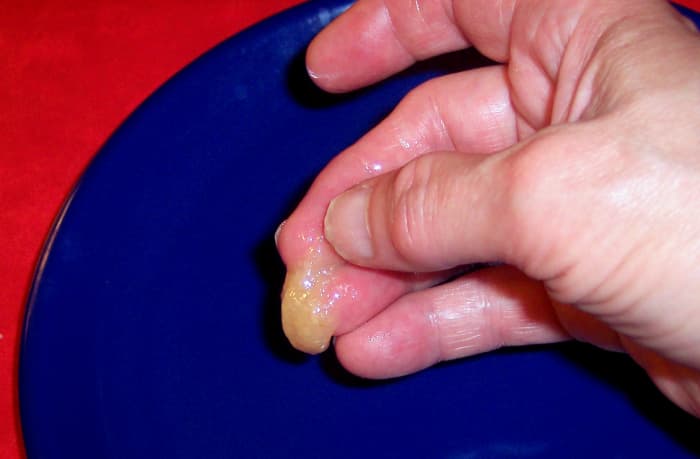 After dropping the fudge mixture into the cold water, use your fingers to bring the thick mixture together. It should just barely hold, but the soft 'ball' doesn't need to be a perfect sphere.
