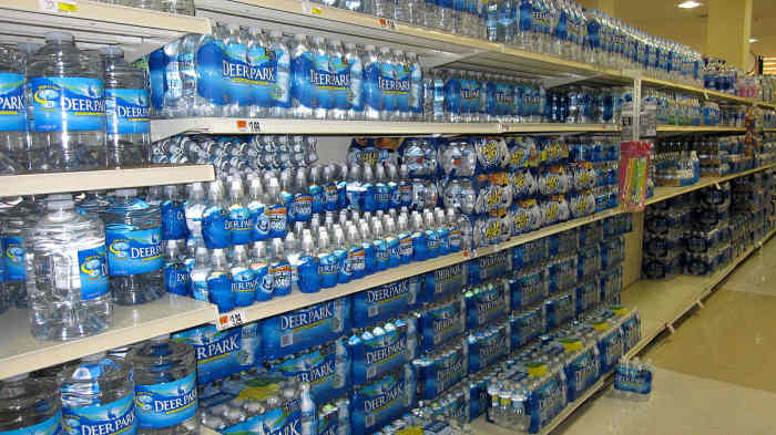 Shelves full of bottled water.