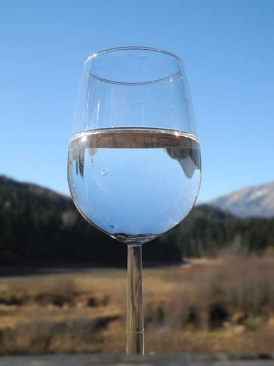 A close-up on a glass of water in a wine glass