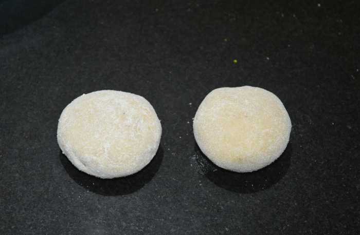 Step five: Pinch out a small portion (lemon-sized) of dough. Make a patty out of it. Dip it in wheat flour. Roll into a 3-inch disc.