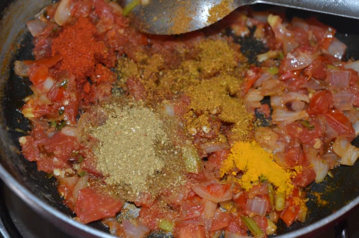 Step three: Add the dry spices: turmeric powder, red chili powder, coriander powder, and garam masala powder. Saute for 1 minute.