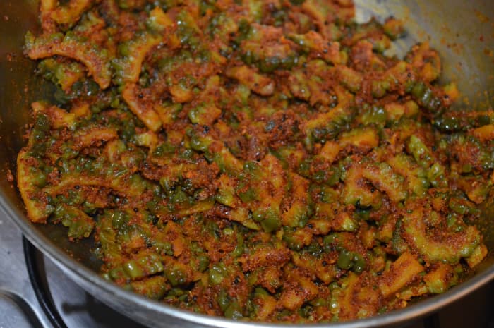 Check for taste. If needed, add some salt. Mix once again. Turn off the heat. Your favorite spicy bitter gourd curry with peanut masala is ready!